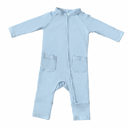 Light blue baby onesie with a zipper on a white background